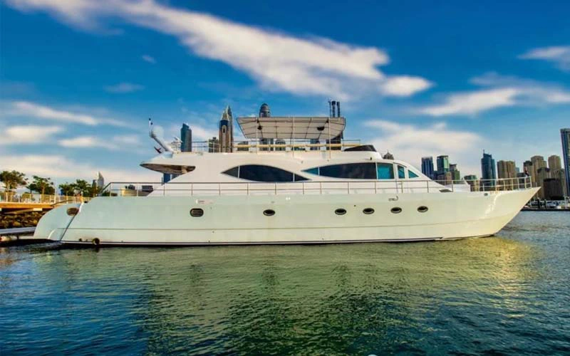 Upper deck of Black Berry Yacht with outdoor seating and open ocean in the background