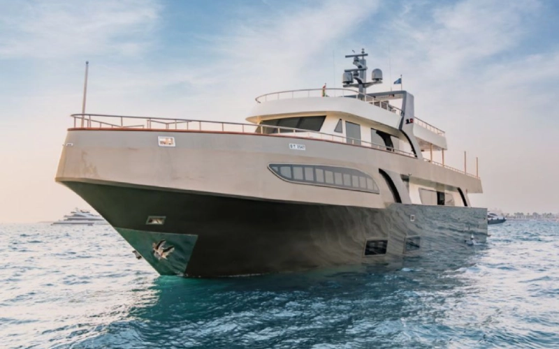 AK yacht sailing across Dubai’s blue waters with sleek modern design – yacht rental in Dubai by Mala Yachts