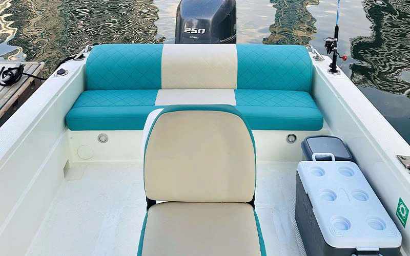 Indoor lounge on Mermaid Yacht with cushioned sofa seating and large windows