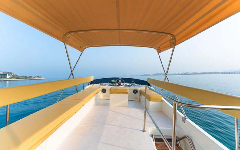 Modern lounge inside Sasmi 48ft Yacht with plush sofas and stylish wooden décor