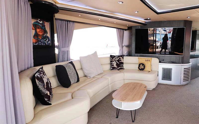 Luxurious lounge inside SunSeeker Yacht with leather seating and panoramic windows