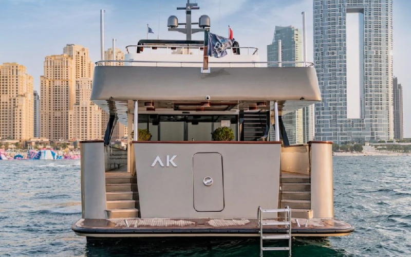Back view of AK Yacht featuring elegant stairs leading to the swim platform and lower deck