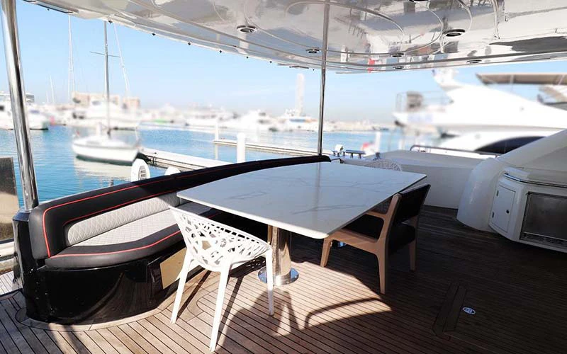 Spacious outdoor deck on SunSeeker Yacht with sun loungers and panoramic ocean backdrop