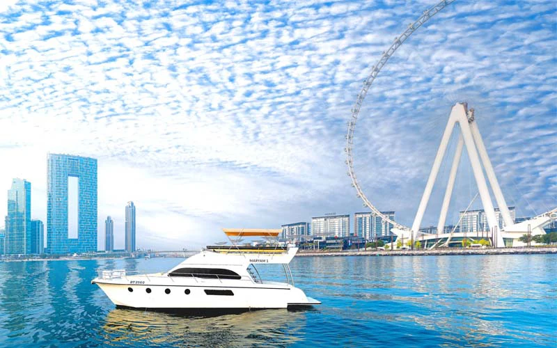 Spacious upper deck of Sasmi 50 yacht with lounge seating and sunshade