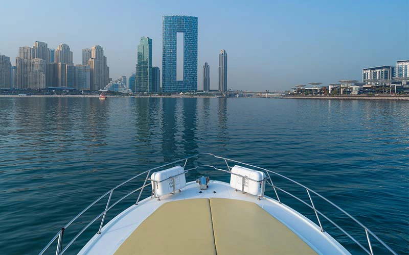 Spacious outdoor deck on Sasmi 50 yacht with cushioned sun loungers and sea view