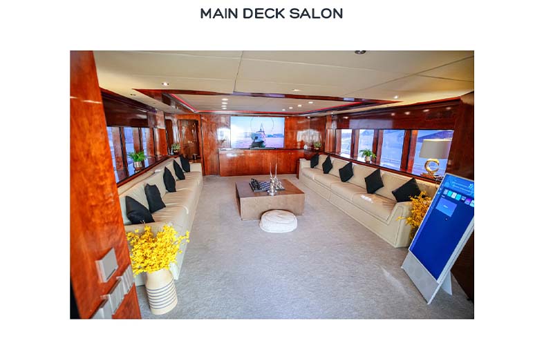 Elegant lounge area inside Mazayal Yacht with cushioned sofas and ambient lighting