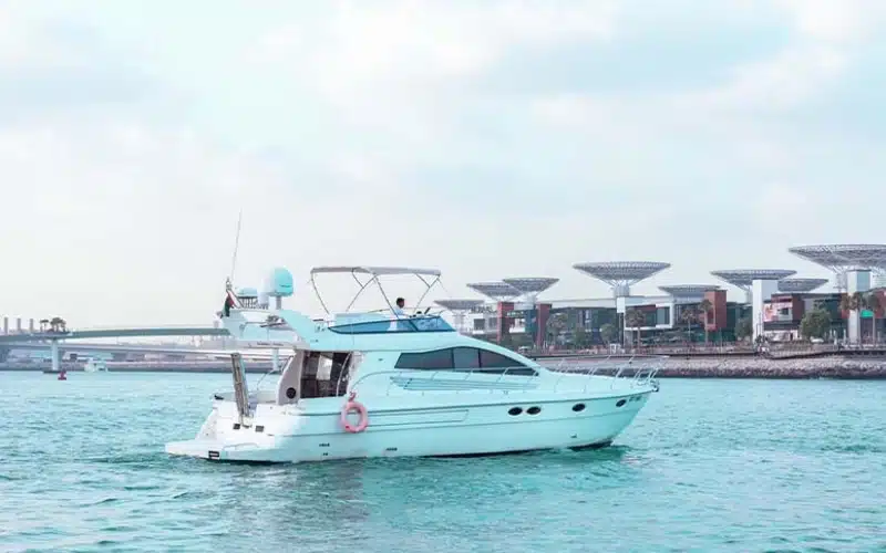 Spacious aft deck of Wrong 2 Yacht featuring cushioned seating, safety railings, and direct access to the swim platform