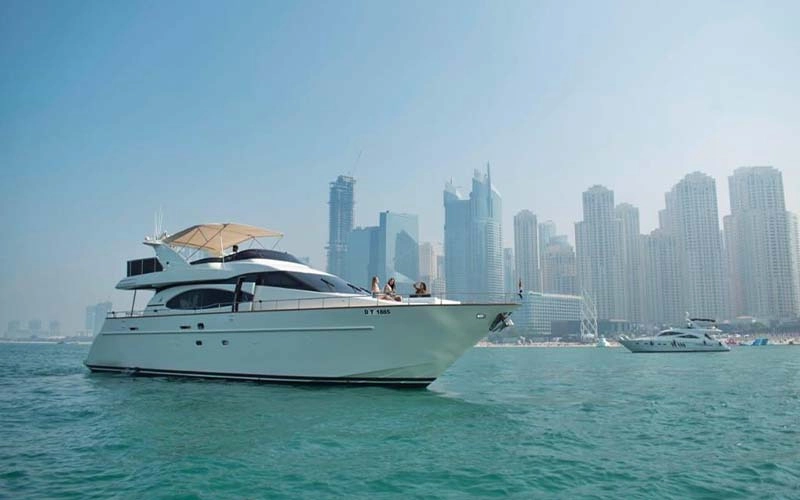 80‑foot Speed Rock Yacht docked against the Dubai skyline, showcasing polished hull and spacious sundeck