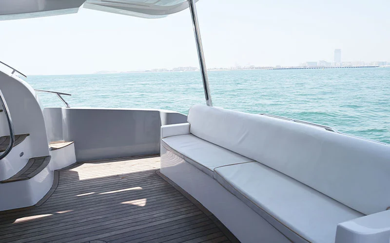 Spacious salon of Maze Yacht with plush seating, hardwood flooring, and panoramic windows