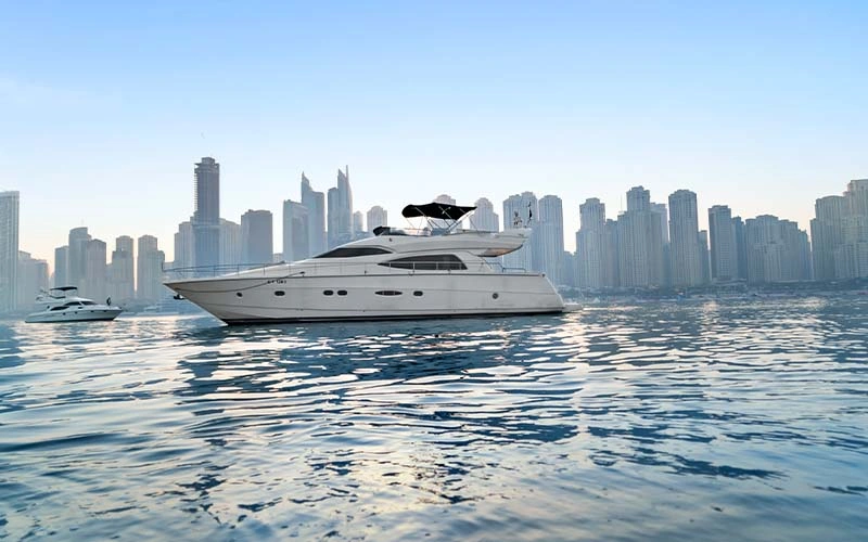 Side view of Lava Yacht anchored near Jumeirah Beach showing sleek lines and spacious decks