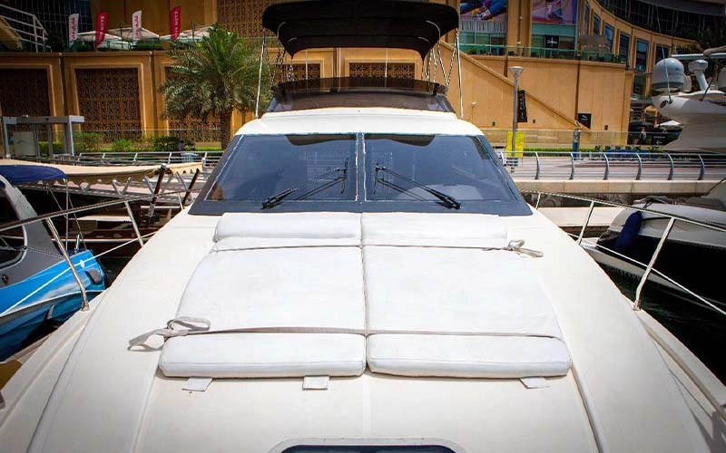 Aft deck of Major Yacht with cushioned loungers and beverage station underneath canopy