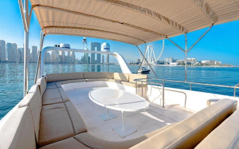 Elegant master stateroom on Ocean Seeker II with a king-size bed, soft linens, wood-paneled décor, and natural light from port windows
