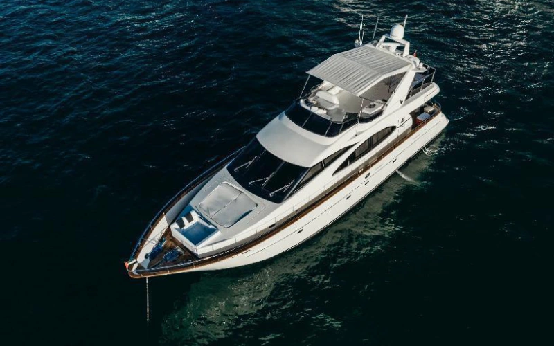 Speed Rock Yacht gliding across the sea with a sleek silhouette and open upper deck for sunbathing and views
