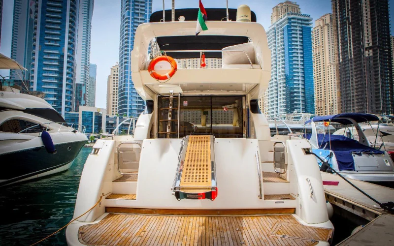 Aft view of Major Yacht showcasing outdoor dining area and cushioned sun deck