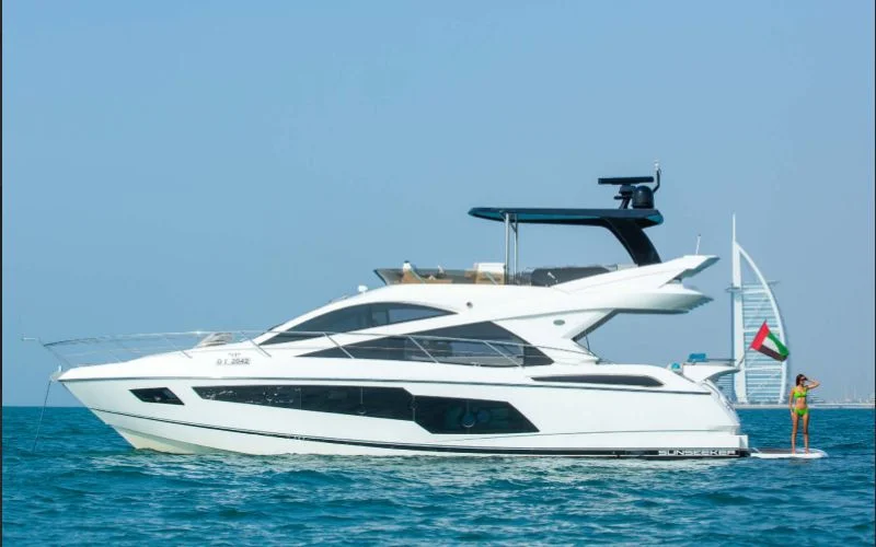 "Outlaw yacht cruising along the Dubai coastline – Mala Yachts offering top-tier yacht rental in Dubai"