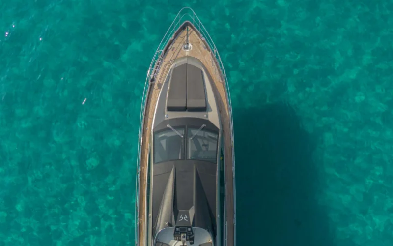 Upper deck view with lounge chairs and ocean backdrop on Morrigan Yacht