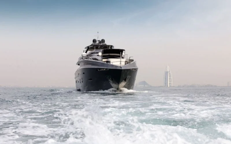"Santorini Silver yacht cruising during golden hour in Dubai – Mala Yachts luxury yacht rental service"