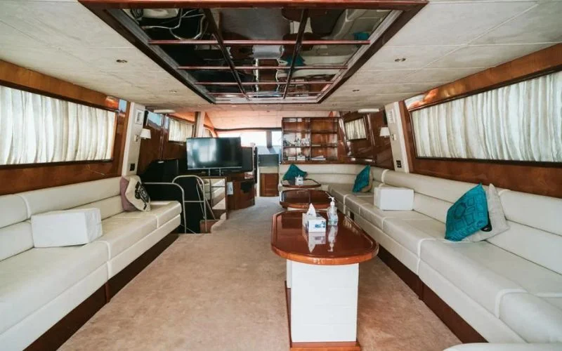 Corridor with wooden flooring and soft lighting in Mayas Yacht interior