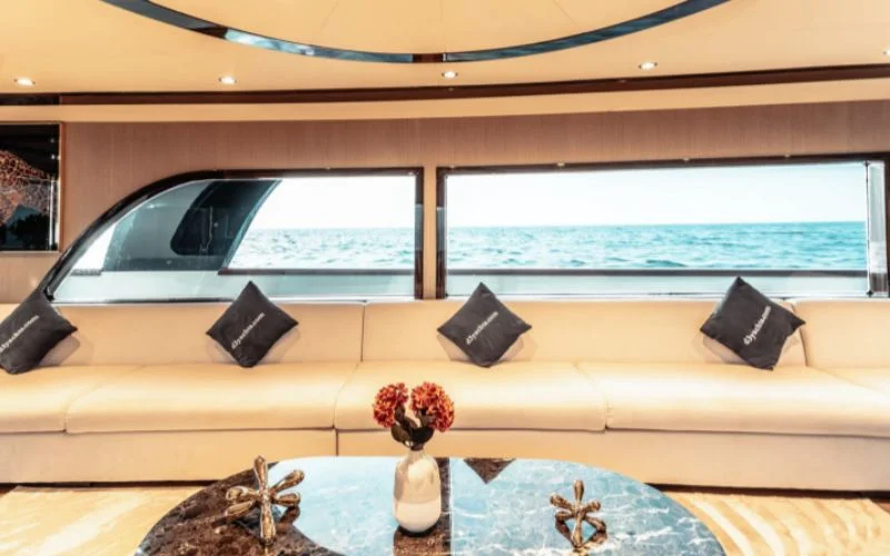 Cozy lounge area with cushioned seating and compact dining setup in D3 33 Yacht