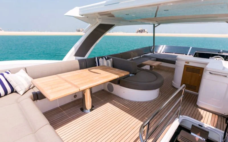 "Elegant lounge area with modern design inside My Serenity yacht – Mala Yachts premium yacht rental in Dubai"