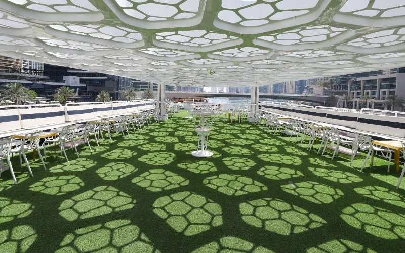 Lavish main salon with plush seating and ambient lighting in Lotus Royale Yacht