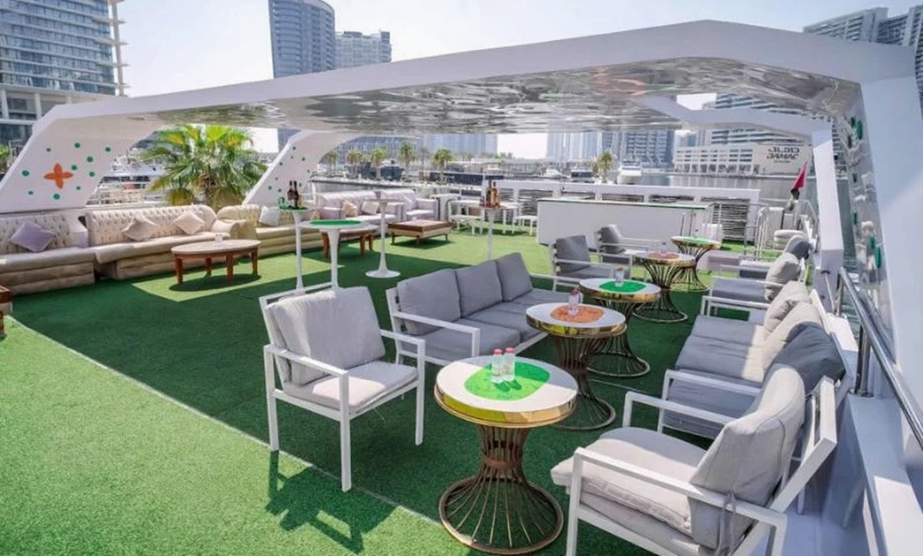 Elegant dining area with polished wood finishes inside 100ft Bela Vita Yacht