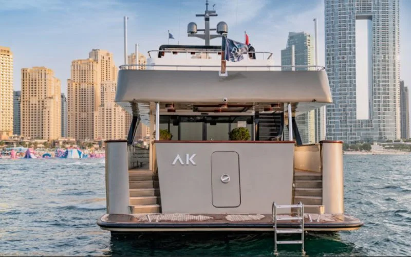 Rear deck view of D3 33 Yacht with cushioned bench and teak flooring