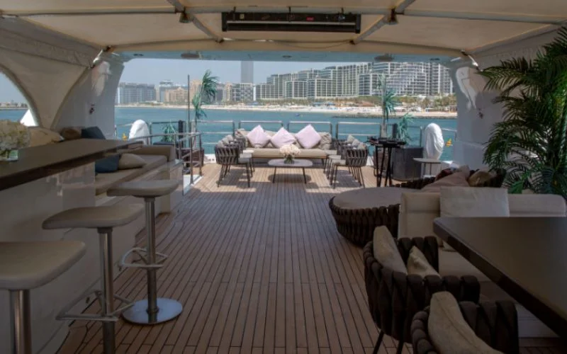 Elegant salon with luxury seating and ambient lighting inside Khalili Yacht