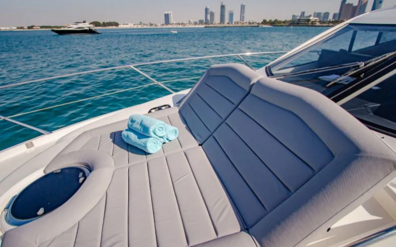 "Fully equipped interior with wooden finishes in Outlaw yacht – Mala Yachts luxury yacht rental Dubai experience"