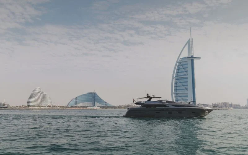 "Santorini Silver yacht anchored along Palm Jumeirah – Mala Yachts trusted yacht rental in Dubai"