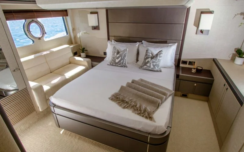 "Elegant bedroom in Outlaw yacht offering comfort and style – Mala Yachts exclusive yacht rental in Dubai"