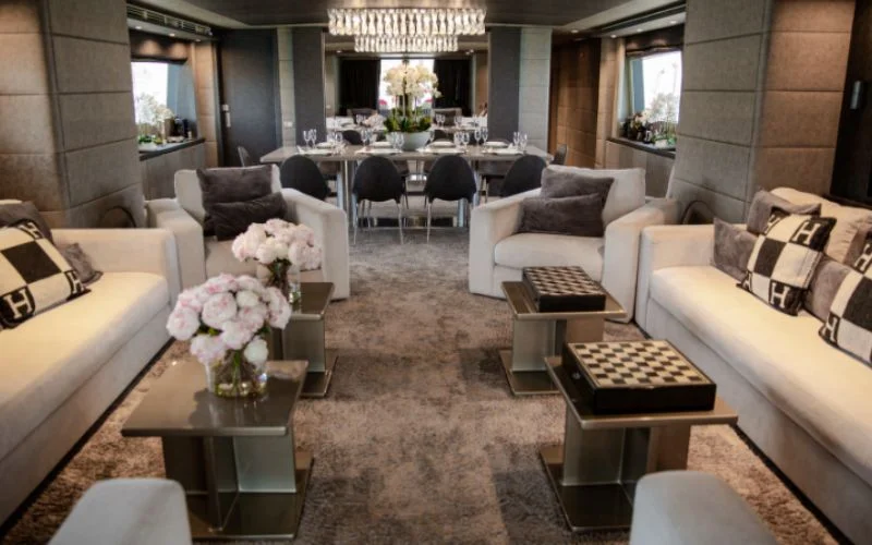 Cozy lounge area with entertainment system and ambient lighting aboard Khalili Yacht