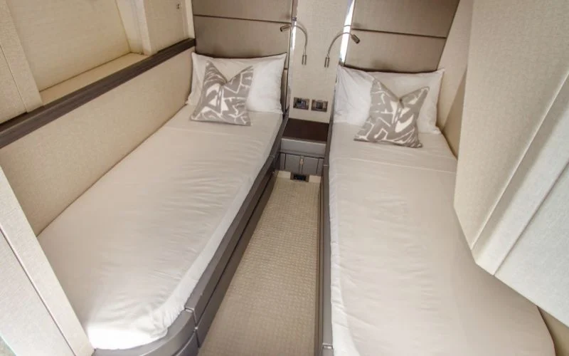 "Spacious double room with elegant décor aboard Outlaw yacht – Mala Yachts premium yacht rental in Dubai"