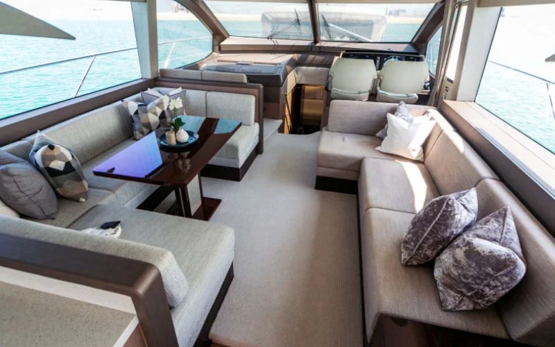 "Chic dining area with sea views inside My Serenity yacht – Mala Yachts exclusive yacht rental in Dubai"