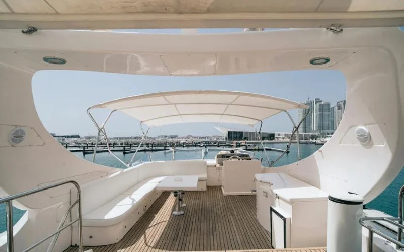 Spacious flybridge with sun loungers and ocean view on Mayas Yacht