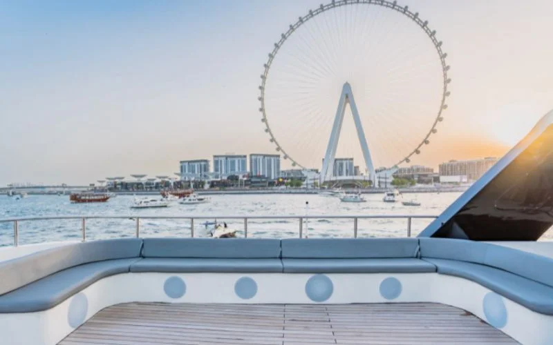 Interior cabin of D3 33 Yacht with sunset light streaming through side windows, creating a warm and cozy ambiance
