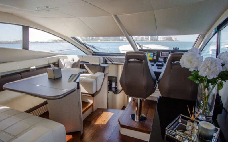 "Modern captain’s helm with advanced navigation on Outlaw yacht – Mala Yachts trusted yacht rental in Dubai"
