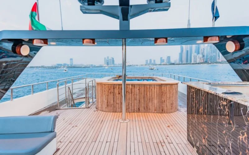 Fold-out bed area with reading lights and compact side shelves in D3 33 Yacht