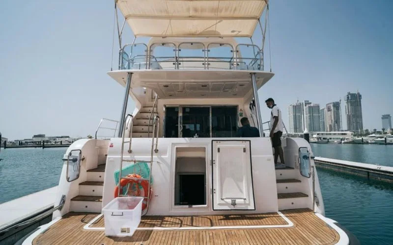 Mayas Yacht’s upper deck with shaded seating and sea view