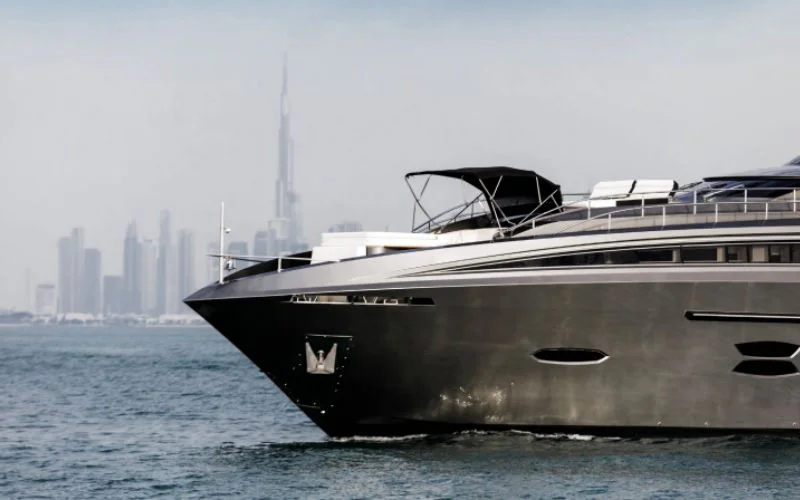 "Side profile of Santorini Silver yacht gliding through Dubai’s coastline – Mala Yachts top-rated yacht rental in Dubai"