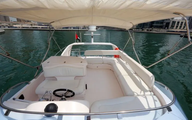 Captain’s cockpit with advanced navigation system and wide windshield inside Al Shali Yacht
