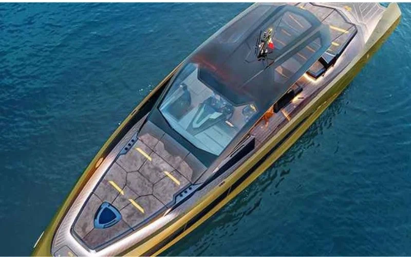 Aft deck of Tecnomar Lamborghini Yacht featuring sunbed loungers and minimalist carbon detailing under open sky