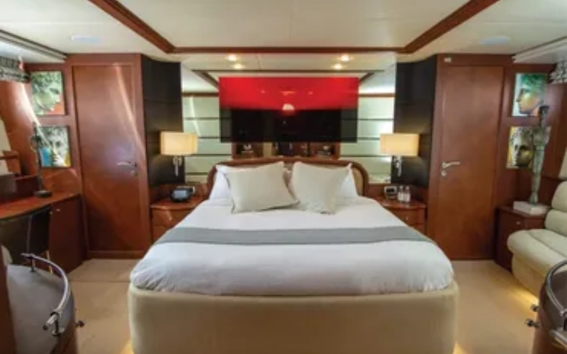 Master bedroom with soft lighting and ocean views aboard Medusa Yacht