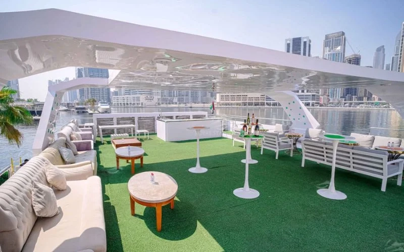 Spacious main salon with luxury sofas and panoramic windows in 100ft Bela Vita Yacht