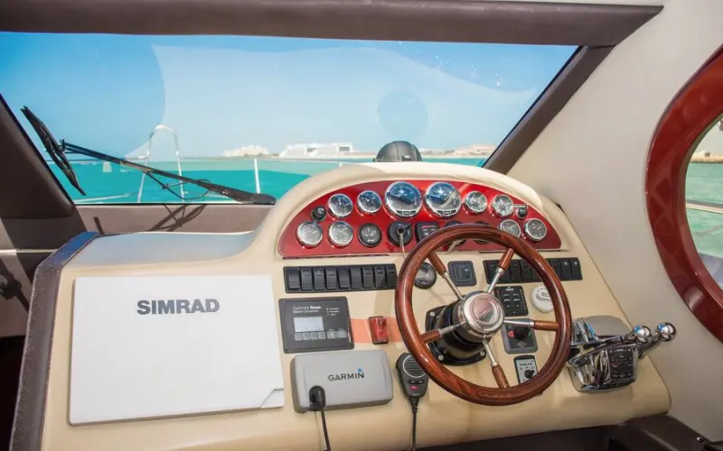 Captain’s cockpit with advanced navigation system and wide windshield inside Al Shali Yacht
