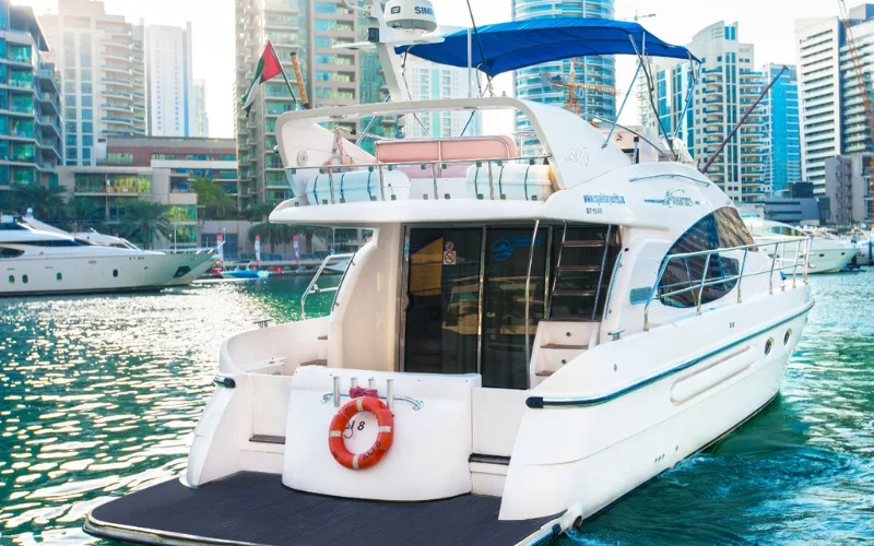 Al Shali Yacht gliding through turquoise waters with modern silhouette