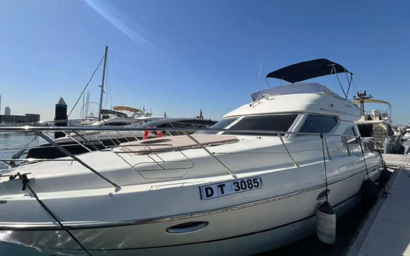 Cranchi yacht docked at Dubai Marina, showcasing Italian craftsmanship – experience exclusive yacht rental in Dubai with Mala Yachts.