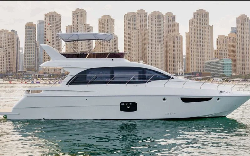 Meridian 45ft yacht anchored near Dubai Marina, showcasing its elegant exterior – Mala Yachts offers luxury yacht rental in Dubai for unforgettable sea moments.