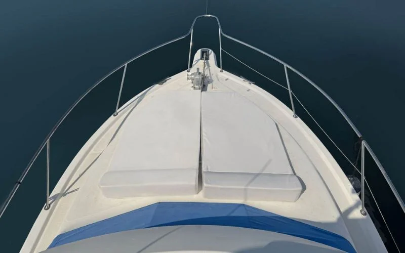 Open-plan salon aboard the Riviera yacht with high-end furnishings and natural lighting – Mala Yachts sets the standard for yacht rental in Dubai.