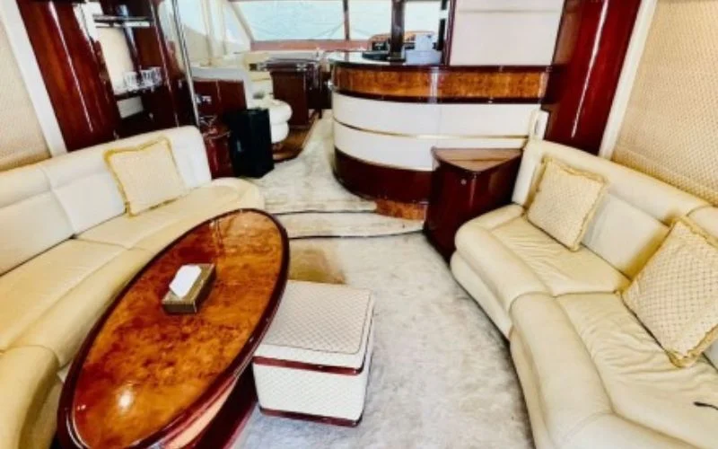 Entertainment lounge inside Majesty 70ft with leather sofas and LED lighting – experience onboard leisure with Mala Yachts’ yacht rental in Dubai.